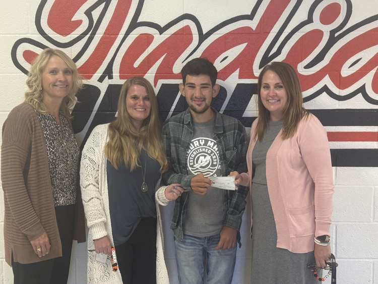 Left to Right - Peggy Bueker (principal), Rosemary Parsons (special education teacher), Angel Roman (previous student), Debi Probst (special education teacher)