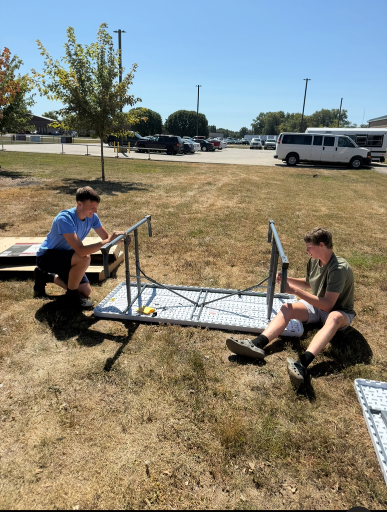 Carson and Nate Picking up the Paddle by putting together the new Picnic Tables!