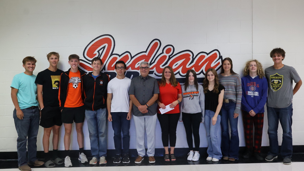 Jeff Rogers, IFP, and Julie Stephens, Effingham Co IFB, present a grant check to the Senior students in Mr. Long's photojournalism class..
