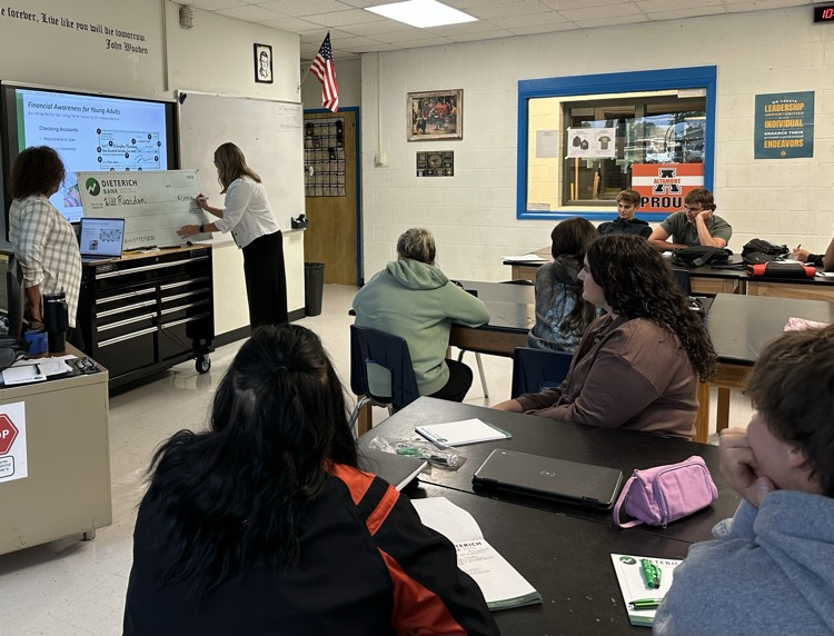 students learning to write a check