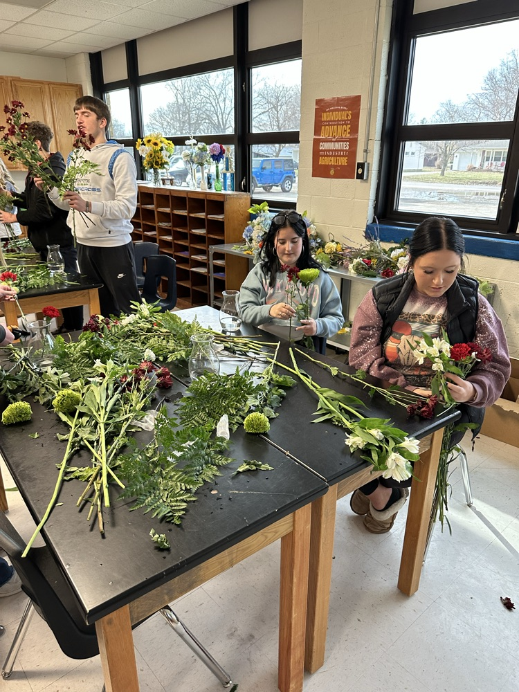 students working in their floral arrangements