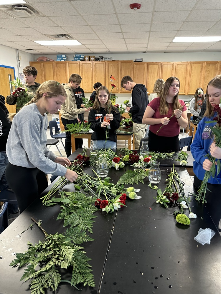 students working in their floral arrangements