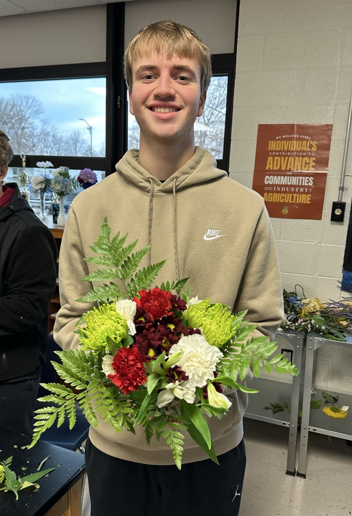 Blake B. showing off his floral arrangement 