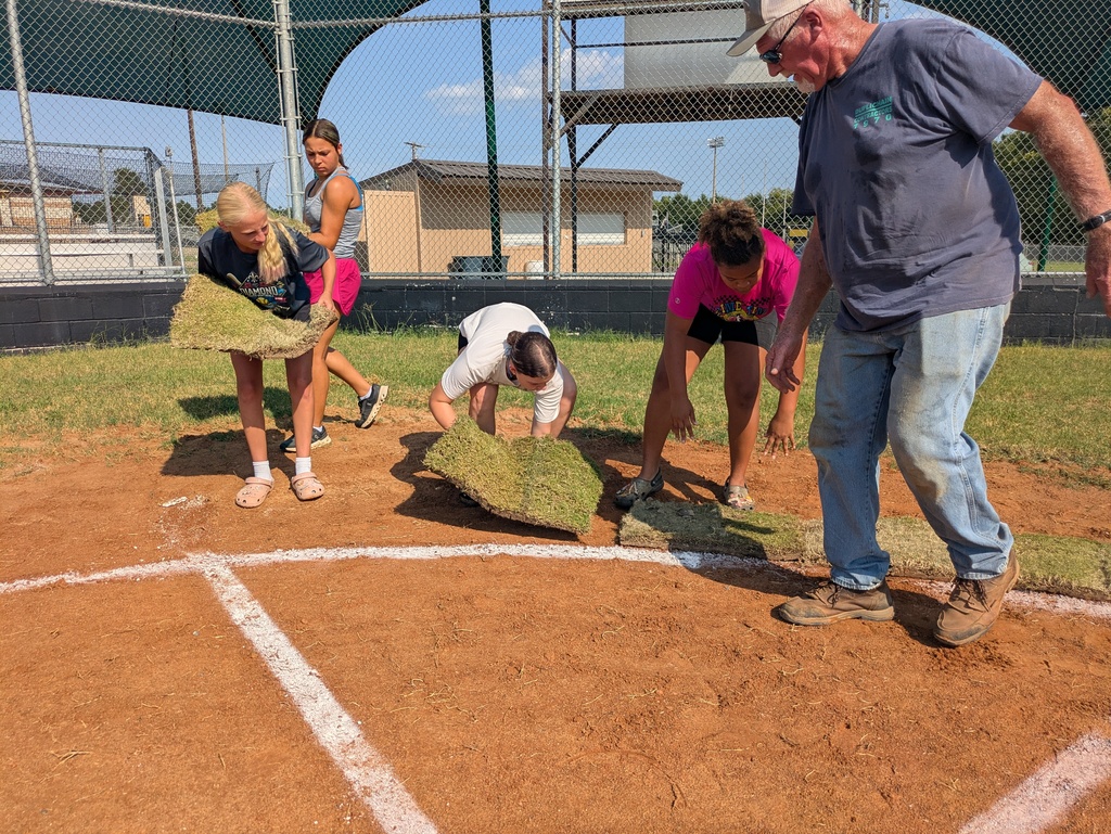 softball player laying sod