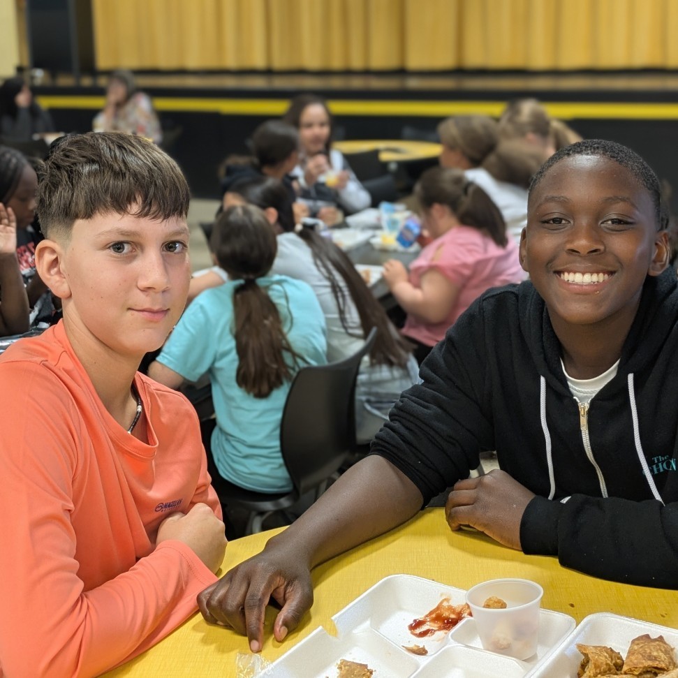 two boys eating lunch