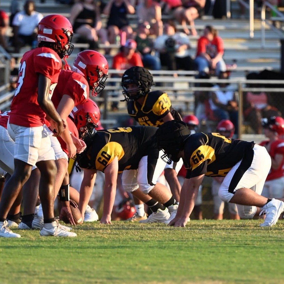 football team on the line of scrimmage