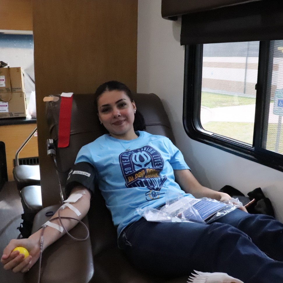 teenage girl donating blood
