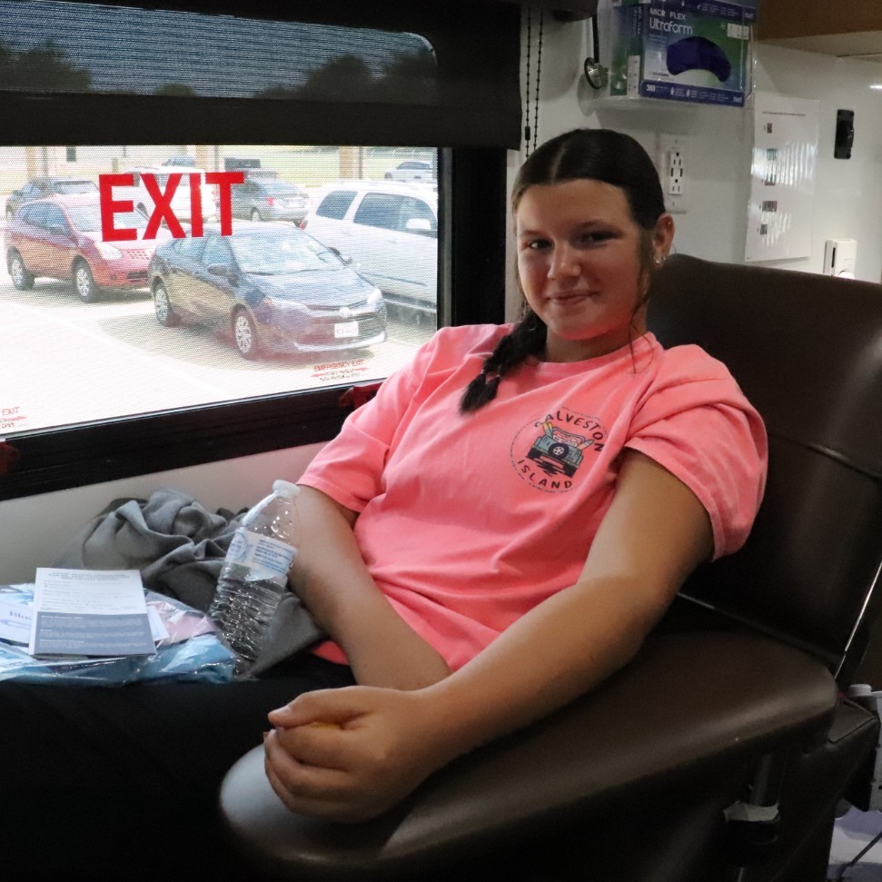 teenage girl donating blood