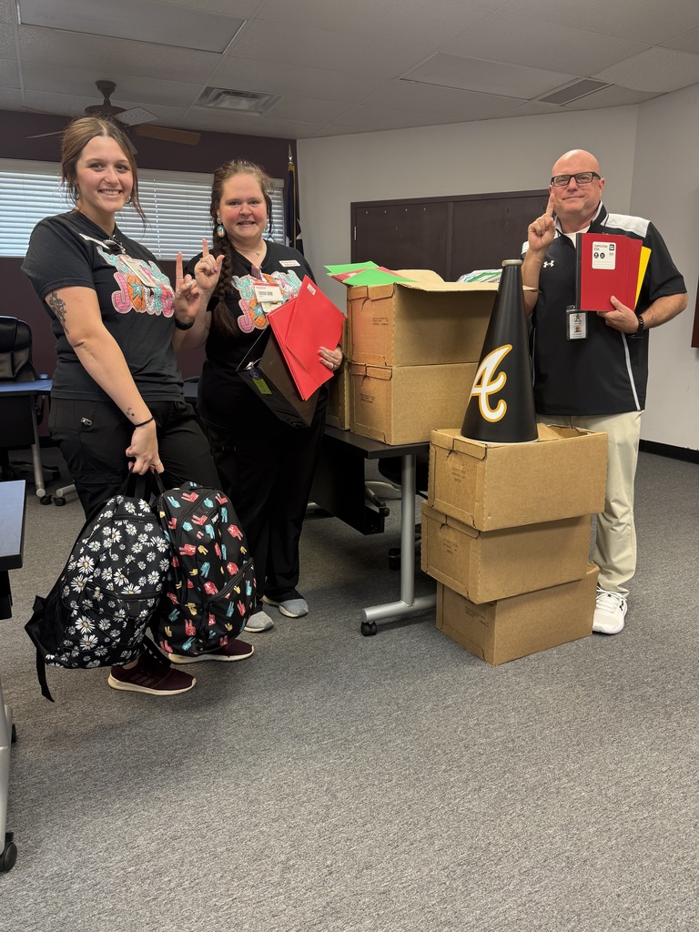 Brookshire Brothers Pharmacy staff holding donated school supplies