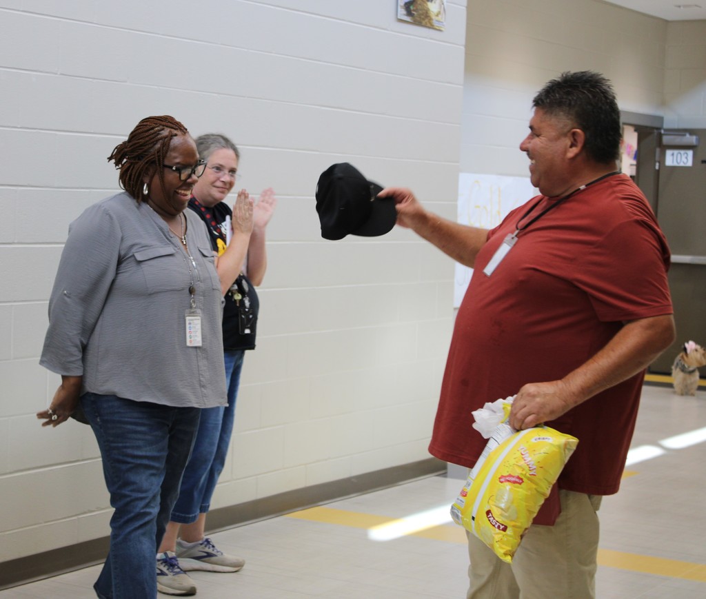 Mrs. Hicks presenting Rodolfo with gifts