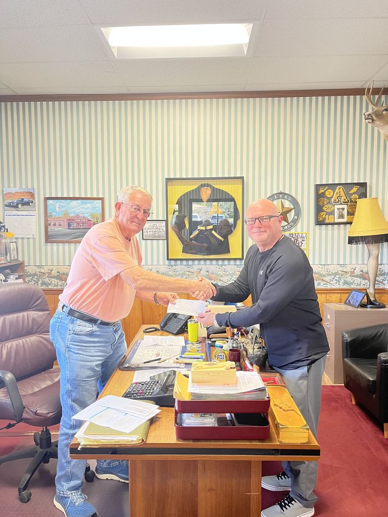 Mr. Pearman and Mr. Conley shaking hands