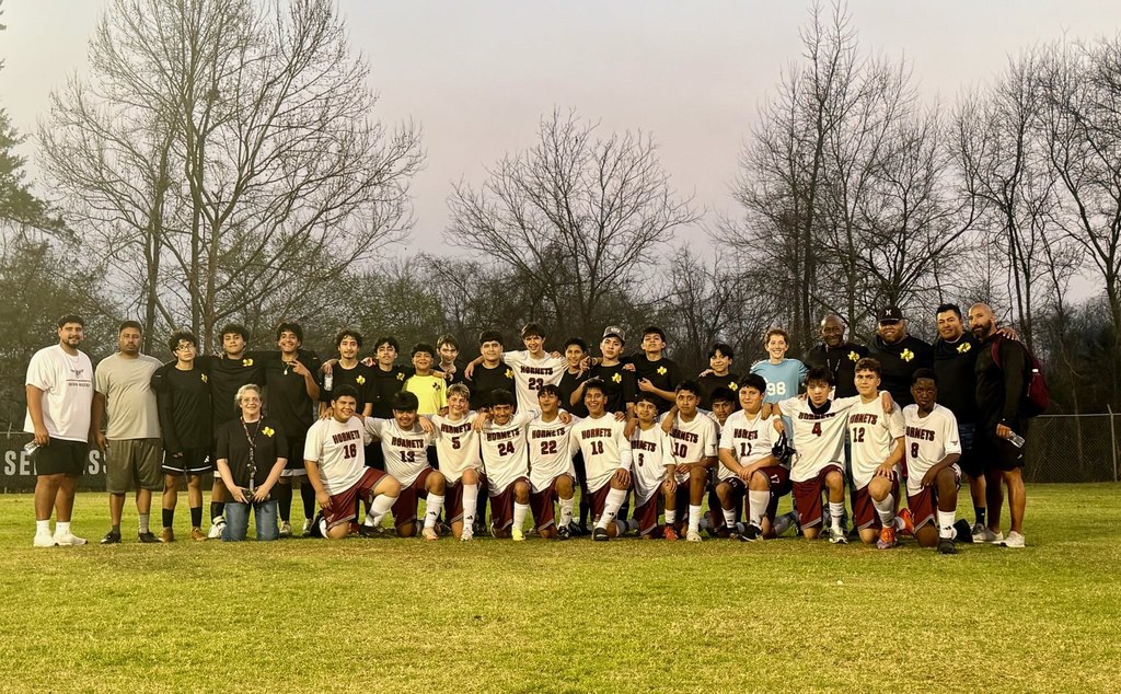 soccer club posing with Hudson team
