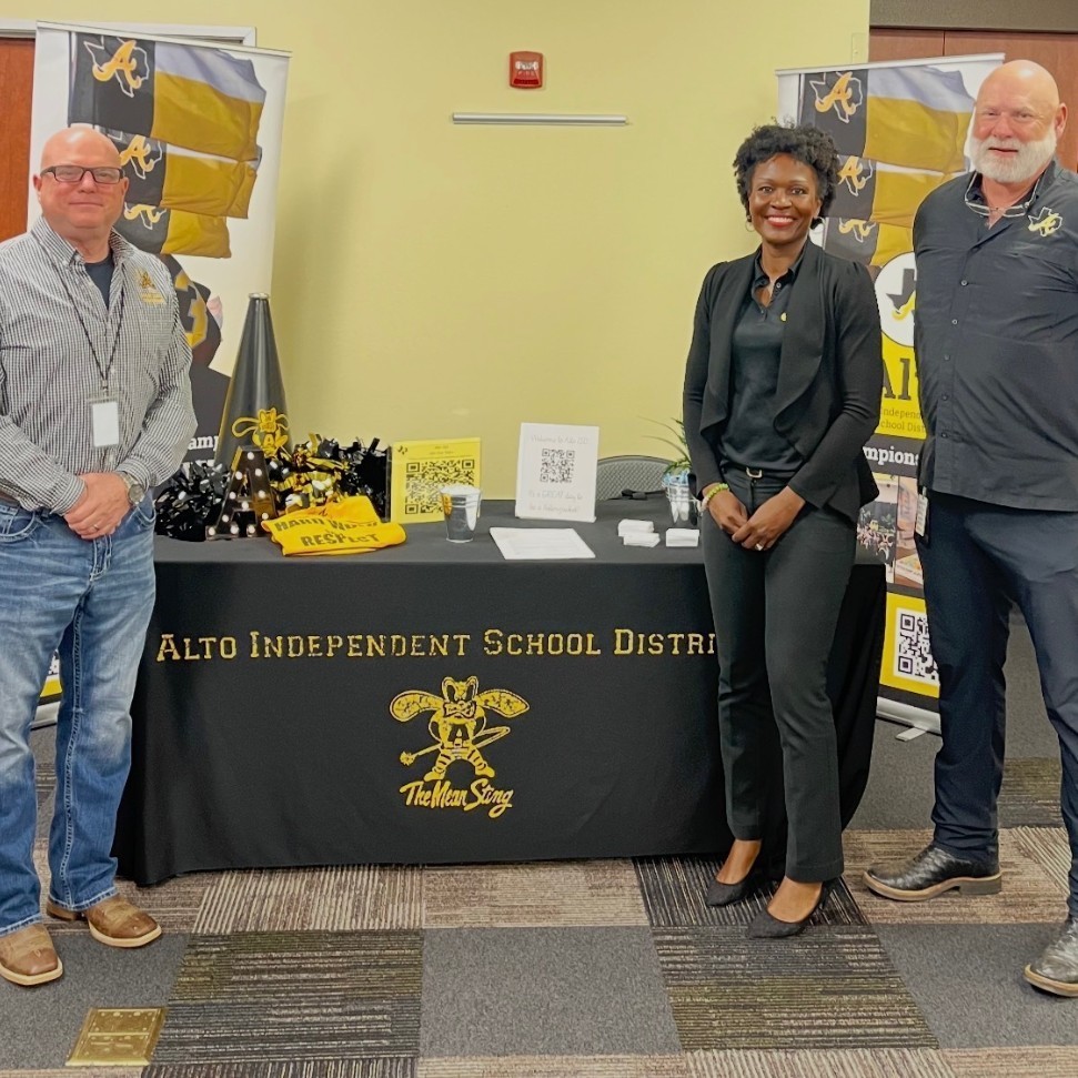 Mr. Conley, Mrs. Dorsey, and Mr. Childs at a recruiting fair