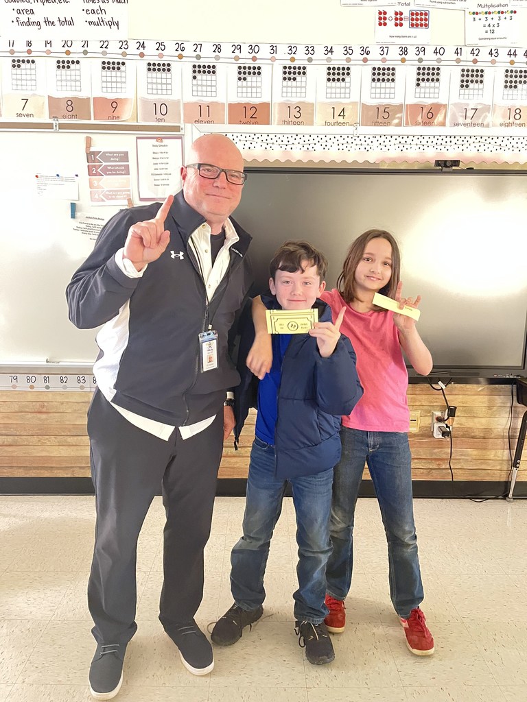 Mr. Conley with two students