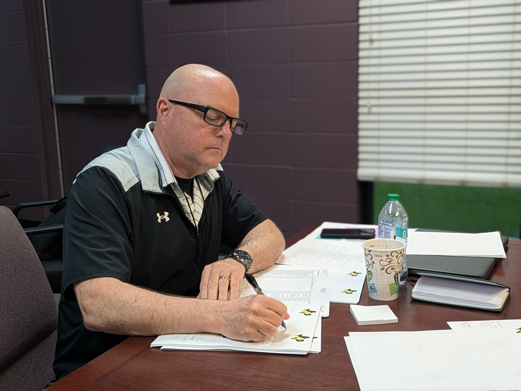 Mr. Conley writing notes