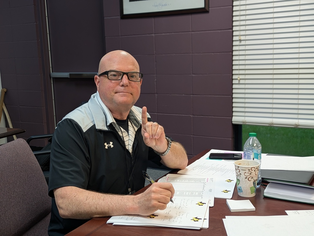 Mr. Conley writing notes