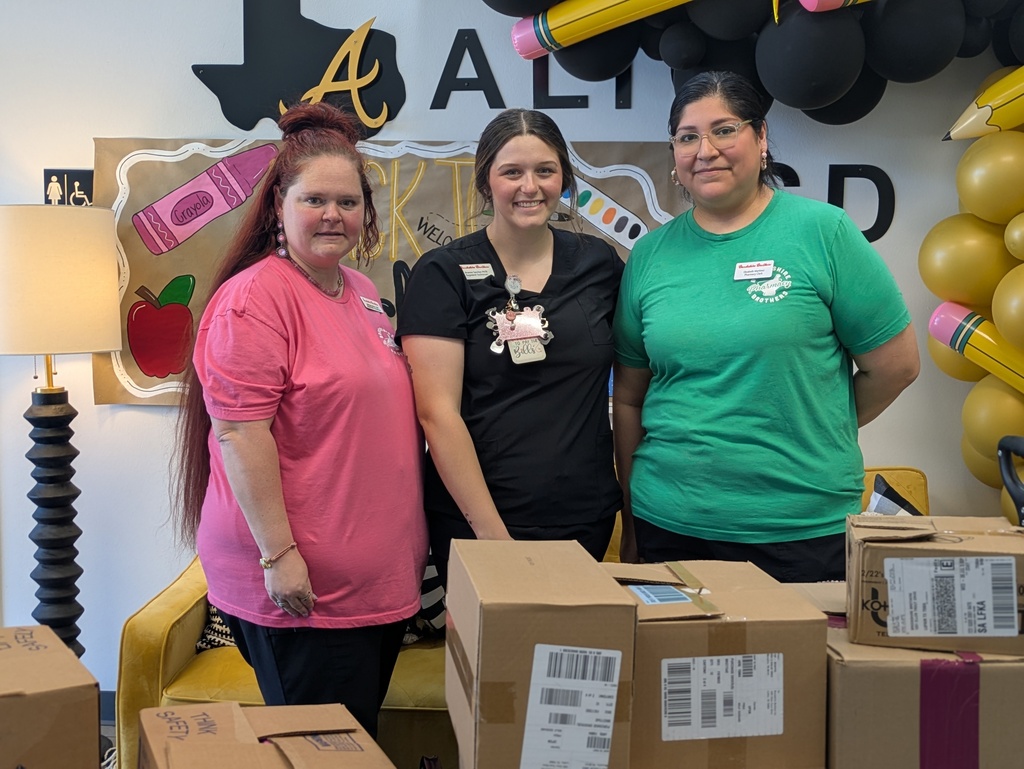 B&B Employees with a mountain of cardboard boxes