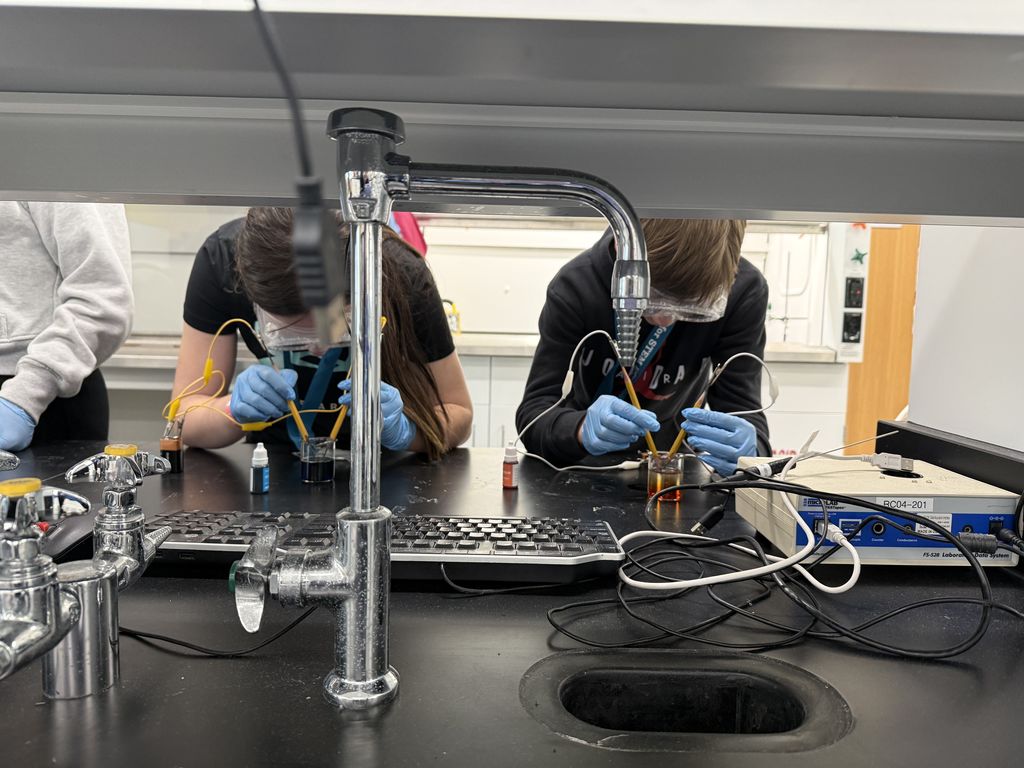 Sophie Middleton and Noah Fetting are pictured splitting water atoms. 