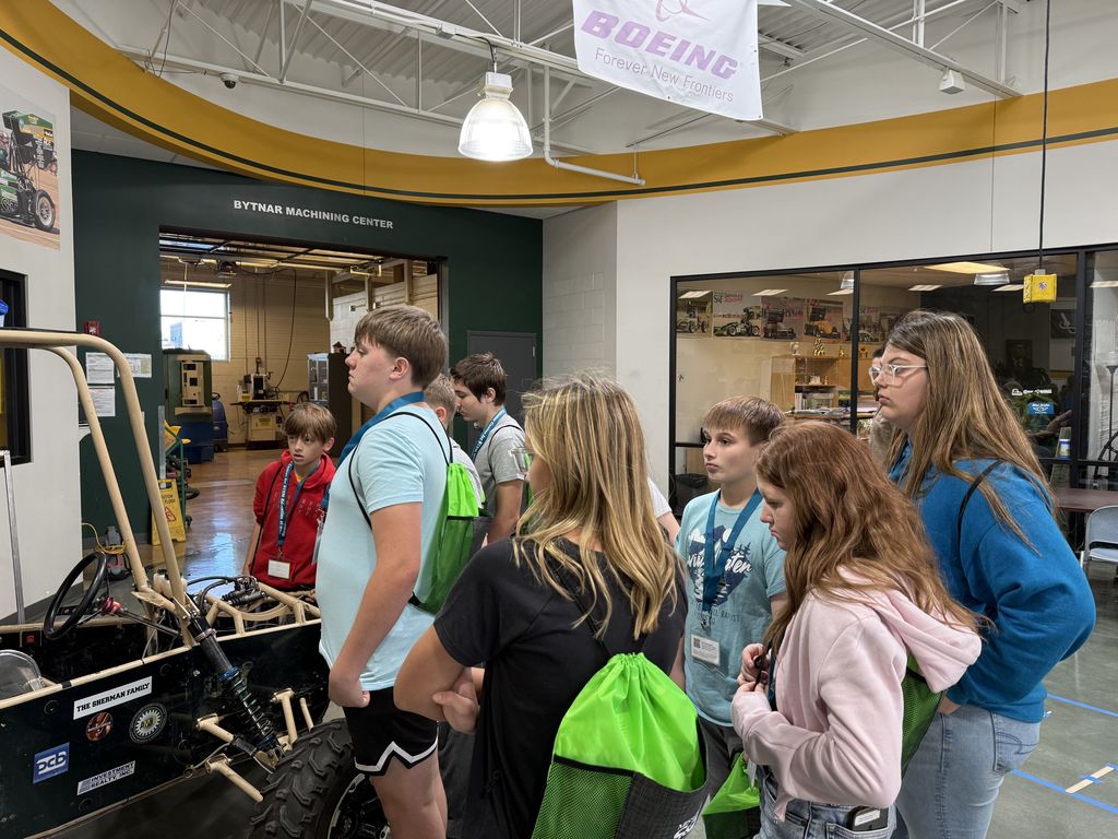 Students listen to the Baja SAE team members talk about their Baja car they fabricate for competitions. 