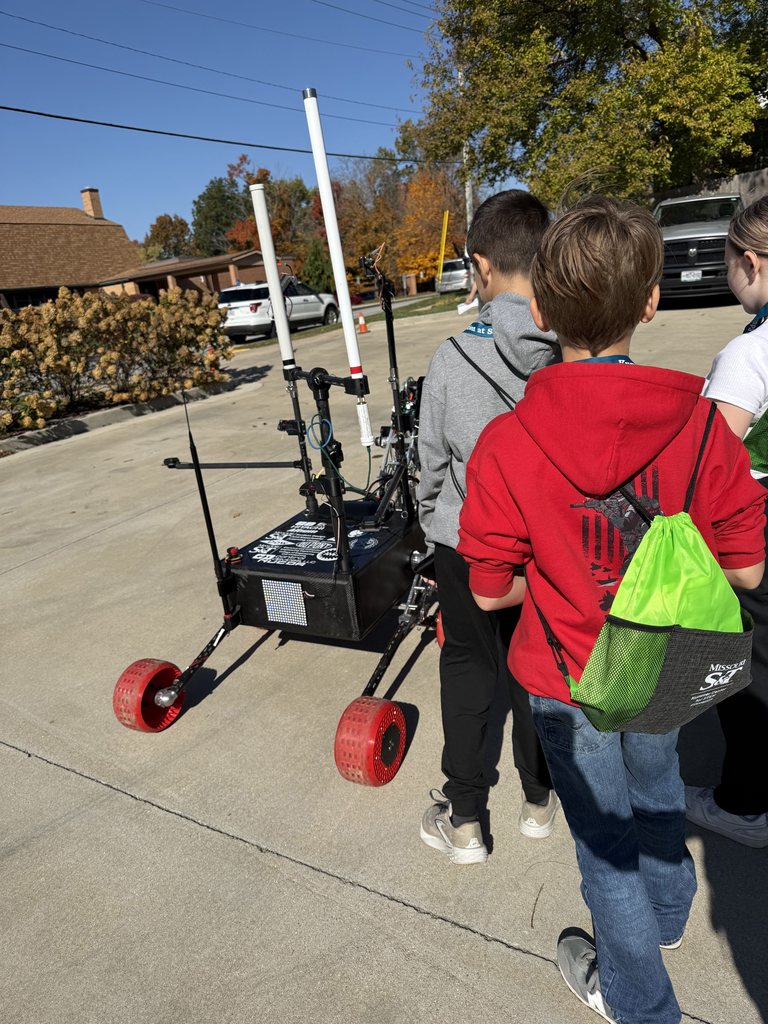 Students seeing the Mars Rover from the Mars Rover Design Team at the Student Design Center. 