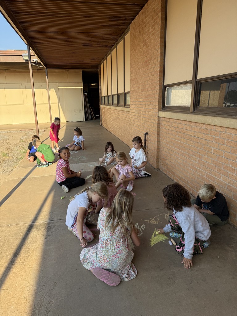 students drawing with chalk