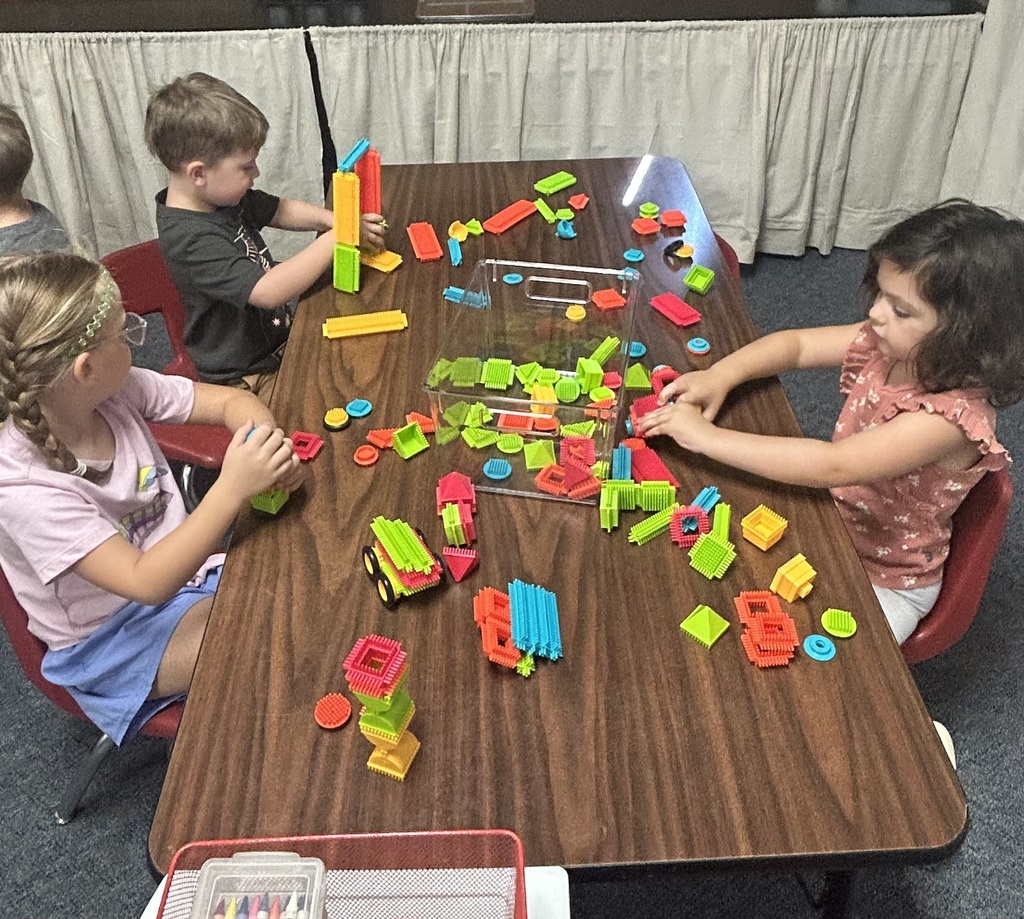 students playing at centers