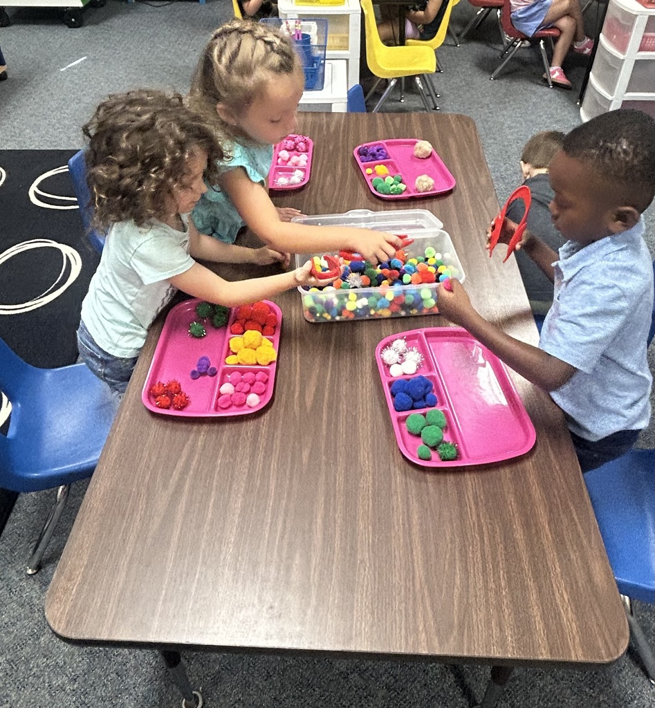 students playing at centers