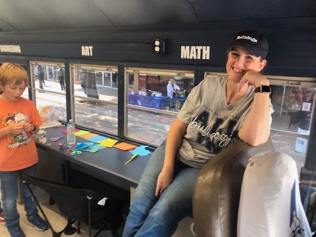 Ms. Monroe helps out with the STEAM Bus!