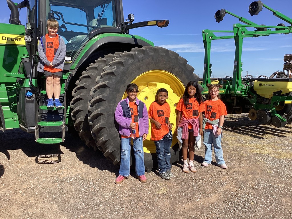 students with a tractor