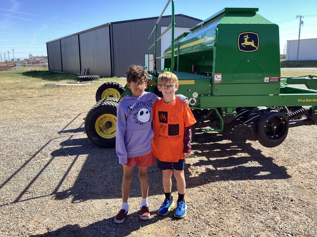students by a tractor