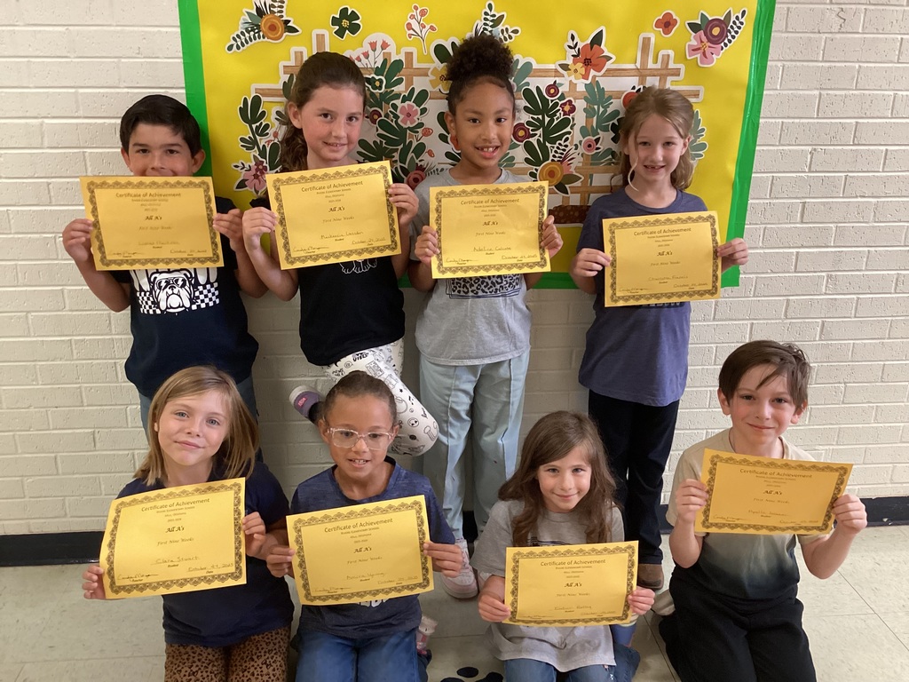 Students with their certificates. 