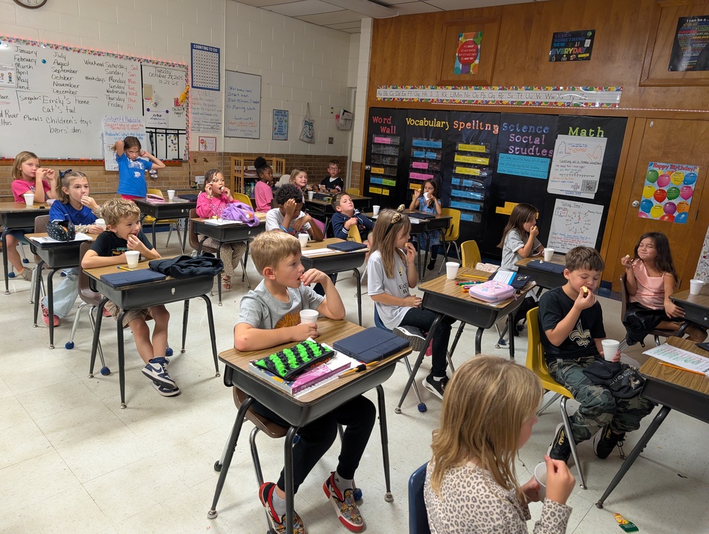 Class of students learning about math.