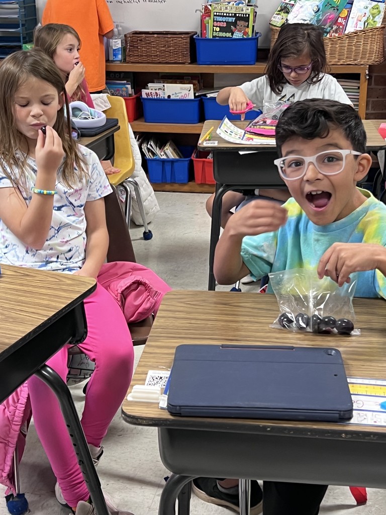 Students eating fruit.