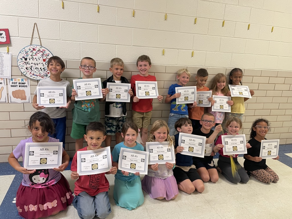 Students with their certificates.