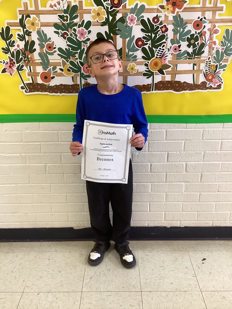 student wtih their certificates