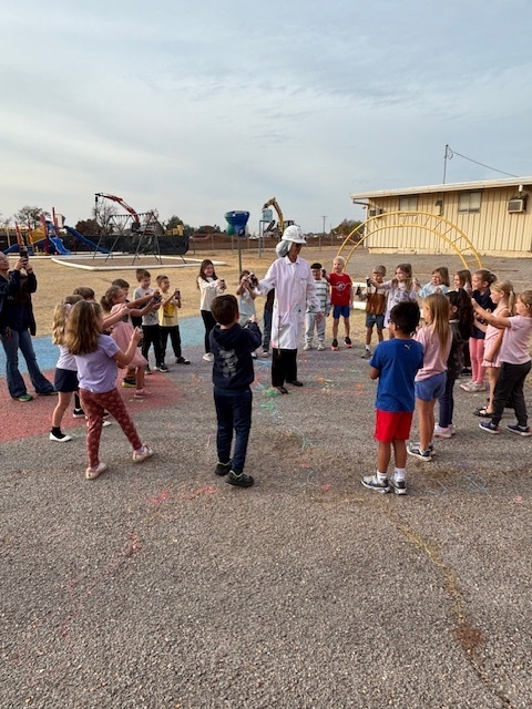 principal being sprayed with silly string.