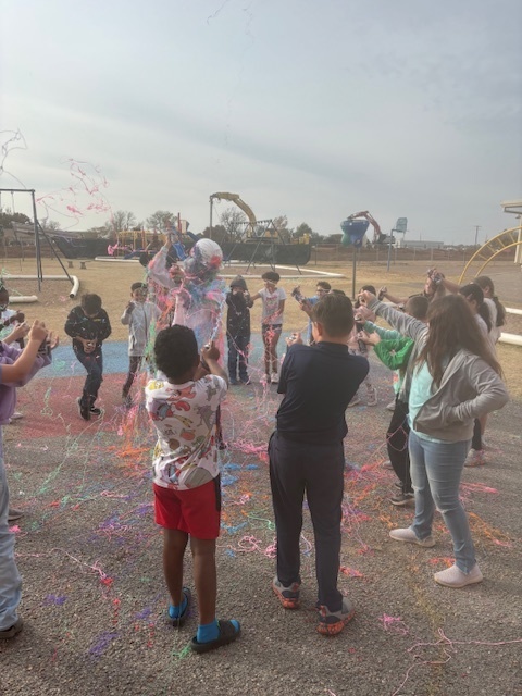 principal being sprayed with silly string.