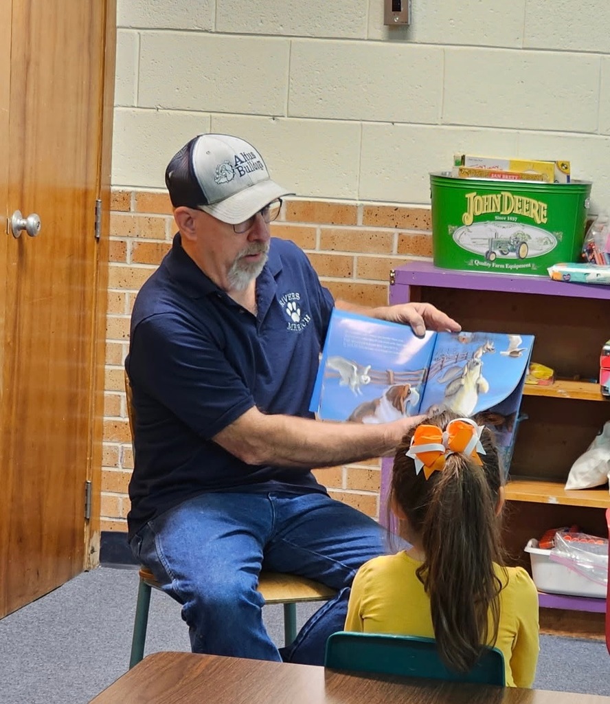 Mr. Rich reading to students.