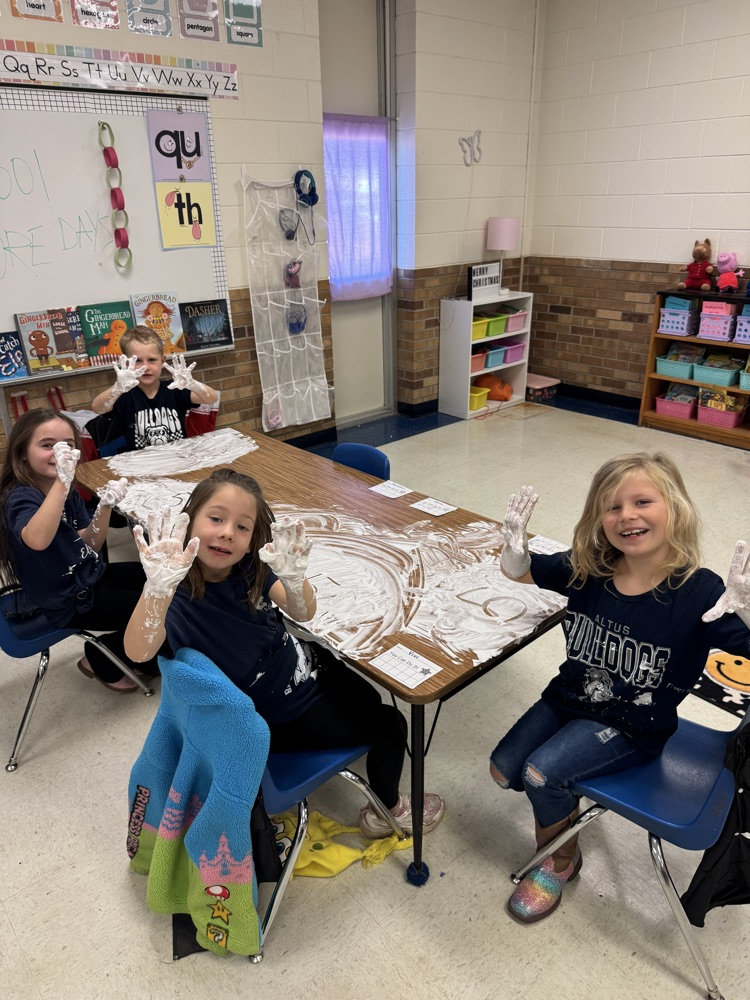 students playing in shaving cream
