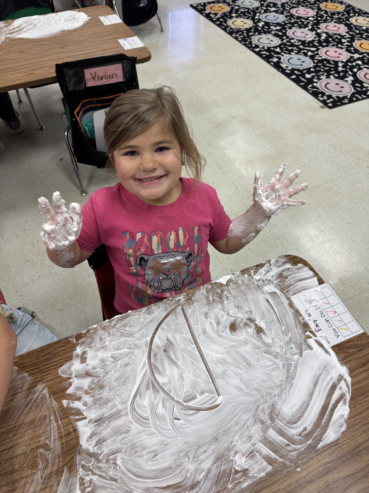 students playing in shaving cream