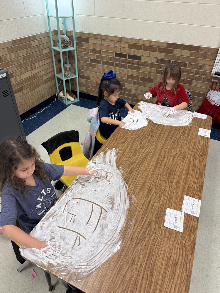 students playing in shaving cream