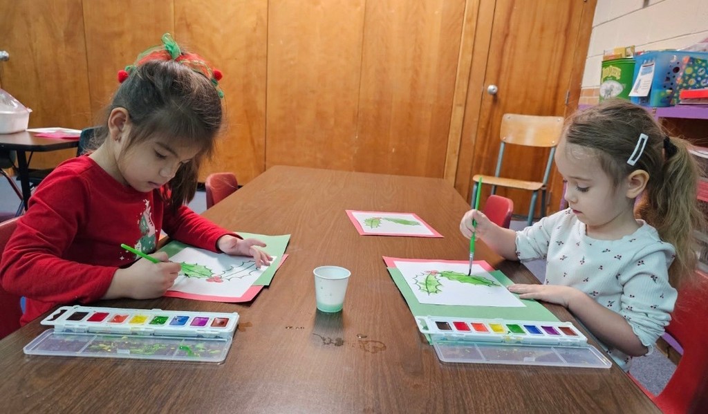 Students painting pictures. 