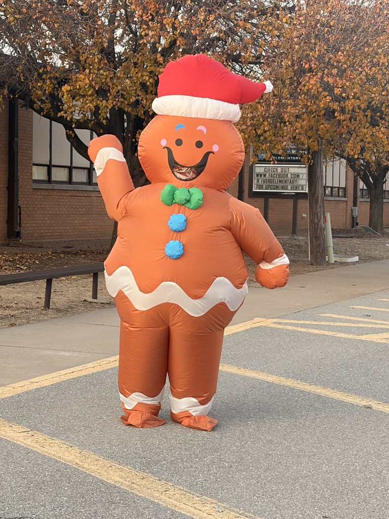 Gingerbread woman hugging a student. 