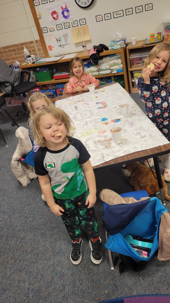 Gingerbread woman hugging a student.