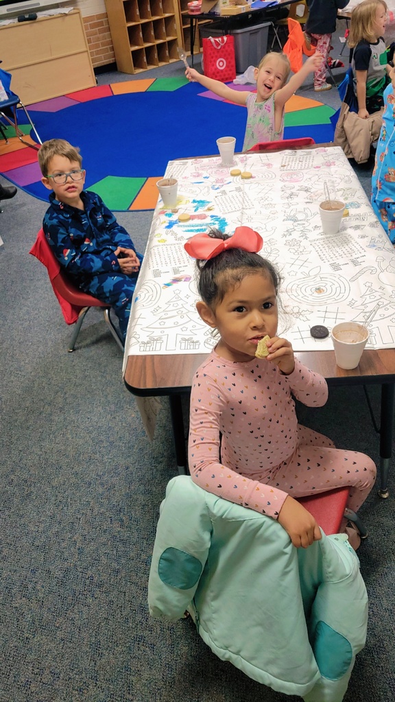 Gingerbread woman hugging a student.
