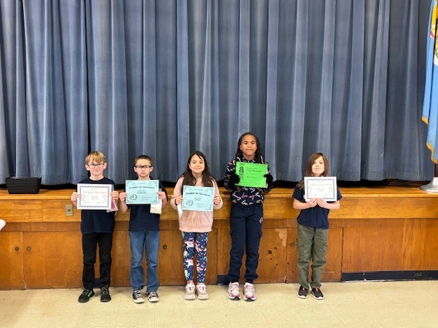 Students with their certificates.