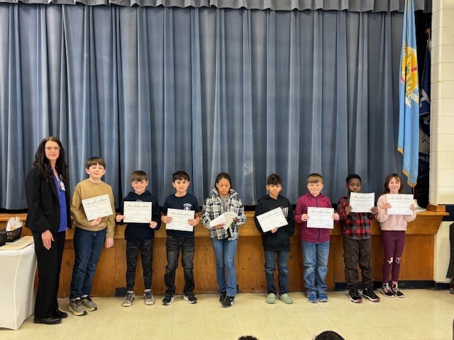 Students with their certificates.