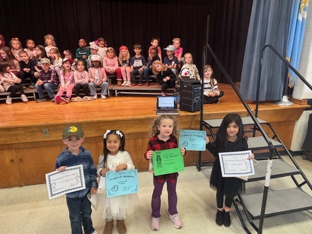 Students with certificates.
