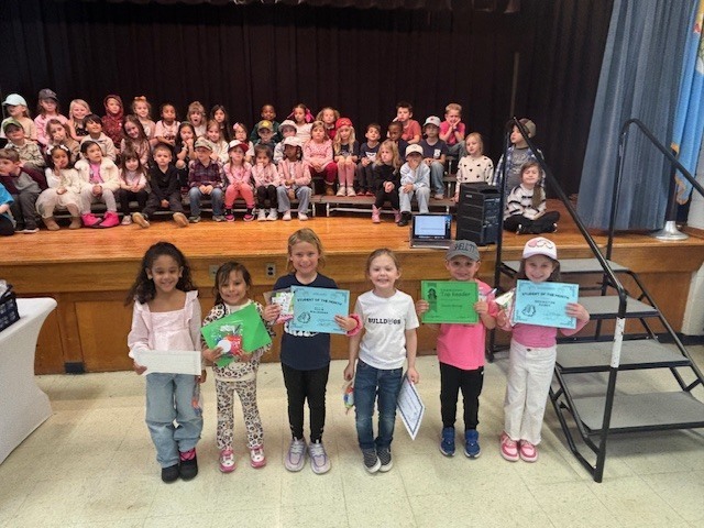 Students with certificates.