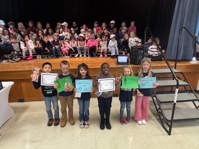 Students with certificates.